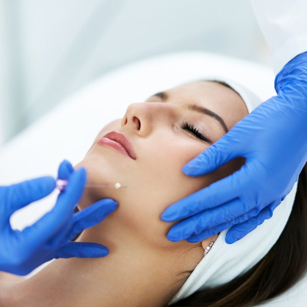 Beautiful young woman getting polydioxanone thread lifting at beauty salon. Thread Lifts