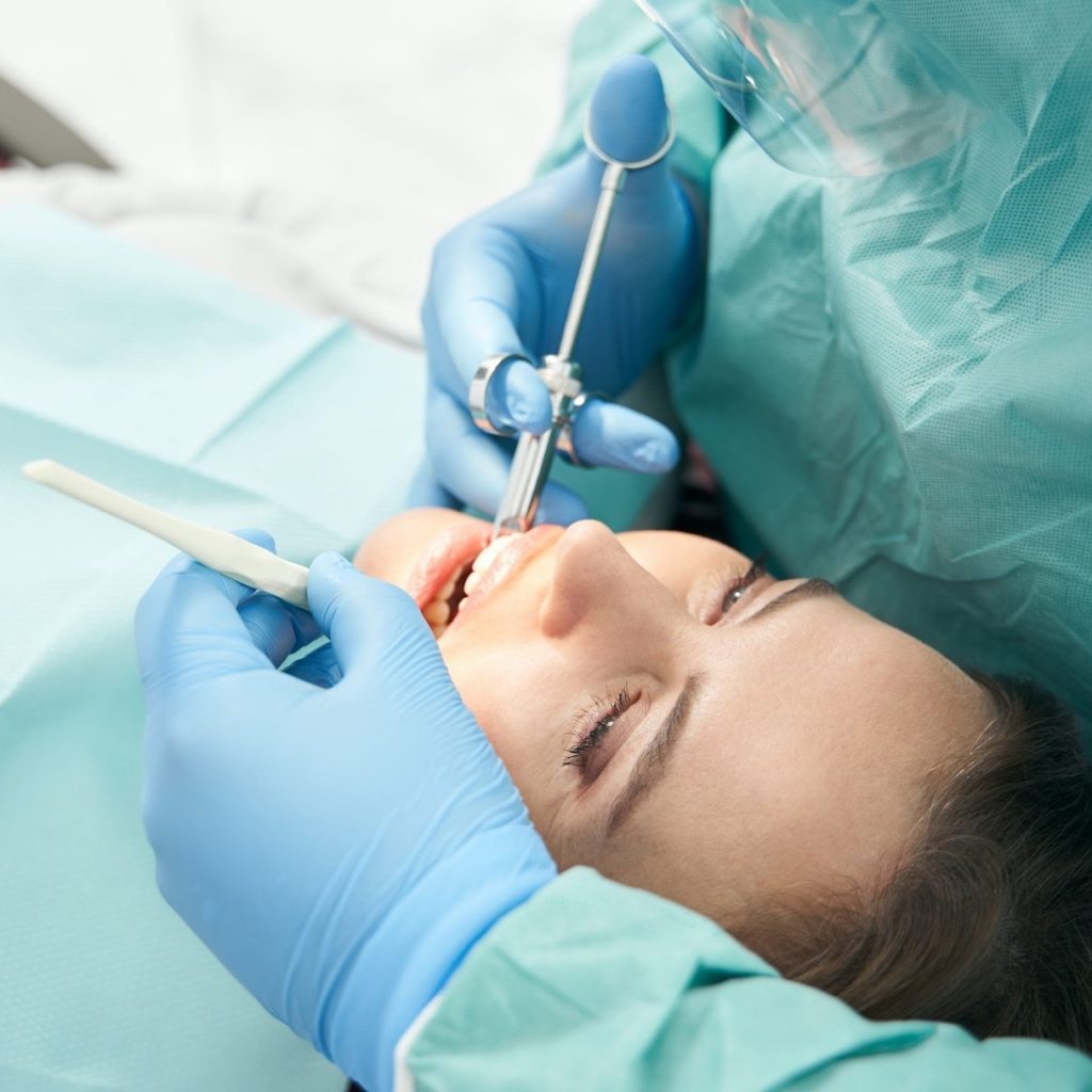 Female patient receiving dental treatment in stomatology clinic Sedation Dentistry