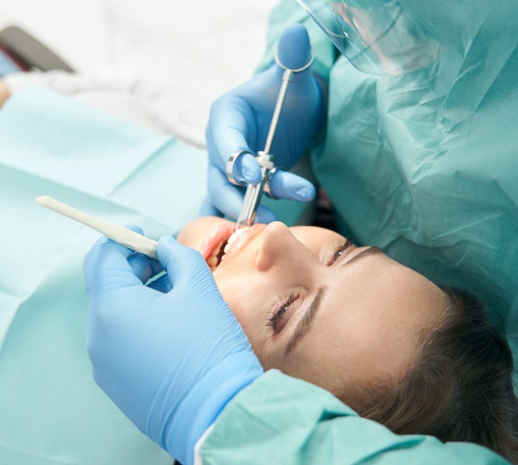 Female patient receiving dental treatment in stomatology clinic Sedation Dentistry