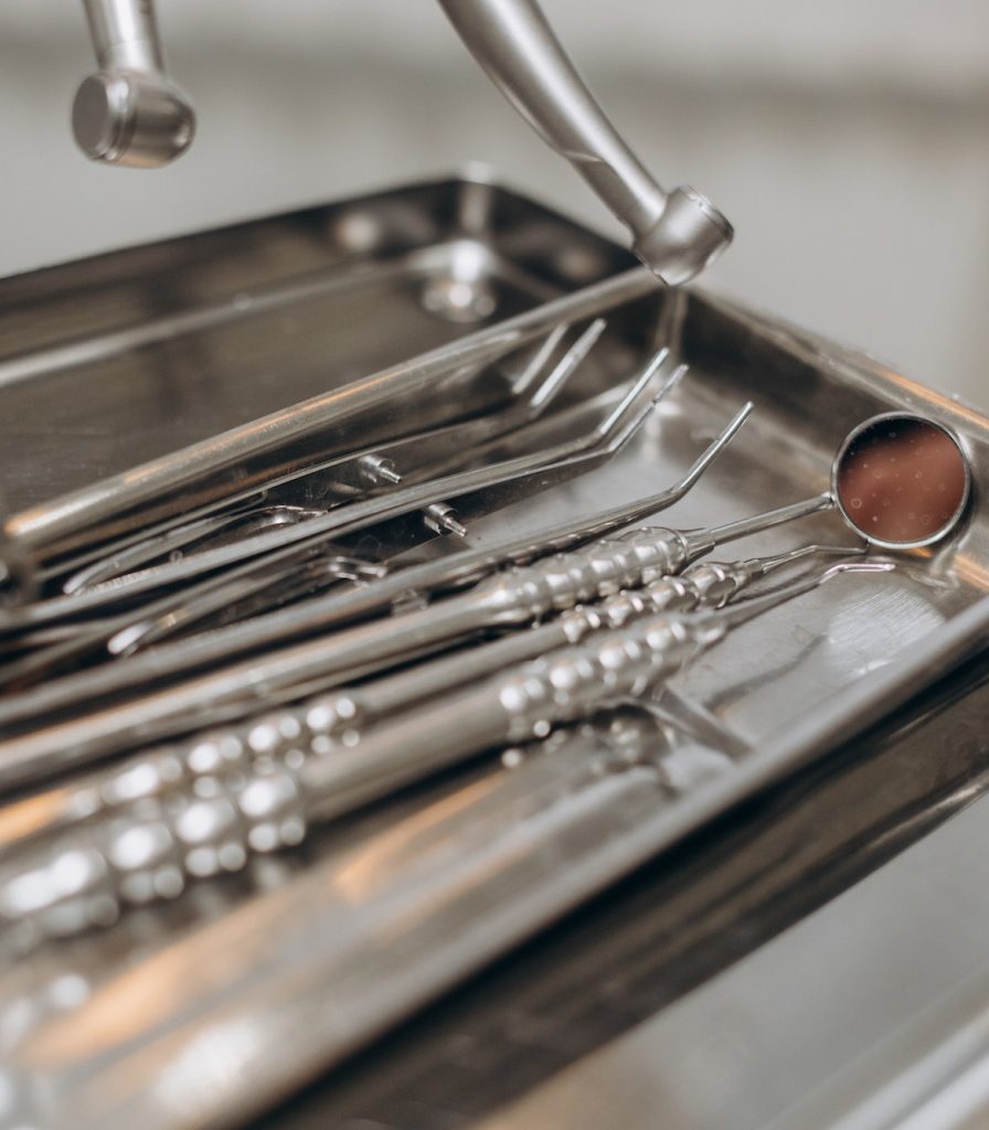 Macro shot of shiny dental tools on modern clinic Surgical Dentistry