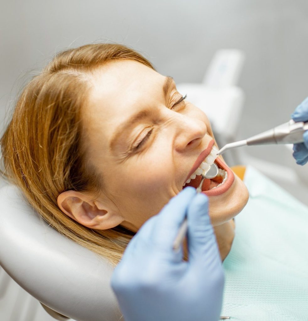 Woman during a teeth inspection at the dental office