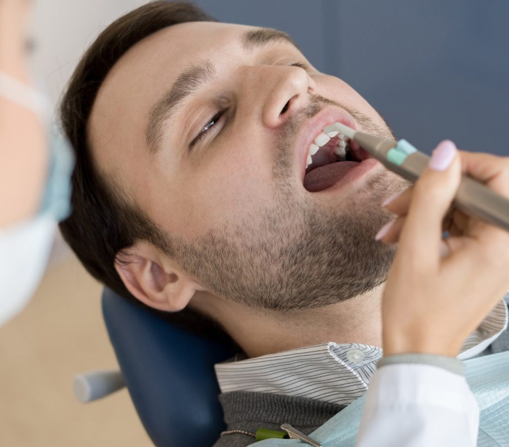 Patient Services Female Dentist Filling Cavities