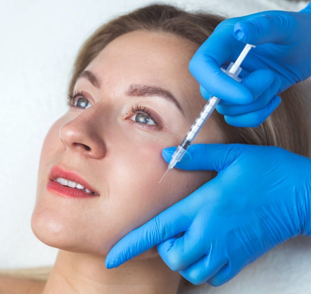 Spa and Cosmetic Rejuvenating facial injections procedure for tightening and smoothing wrinkles on the face skin