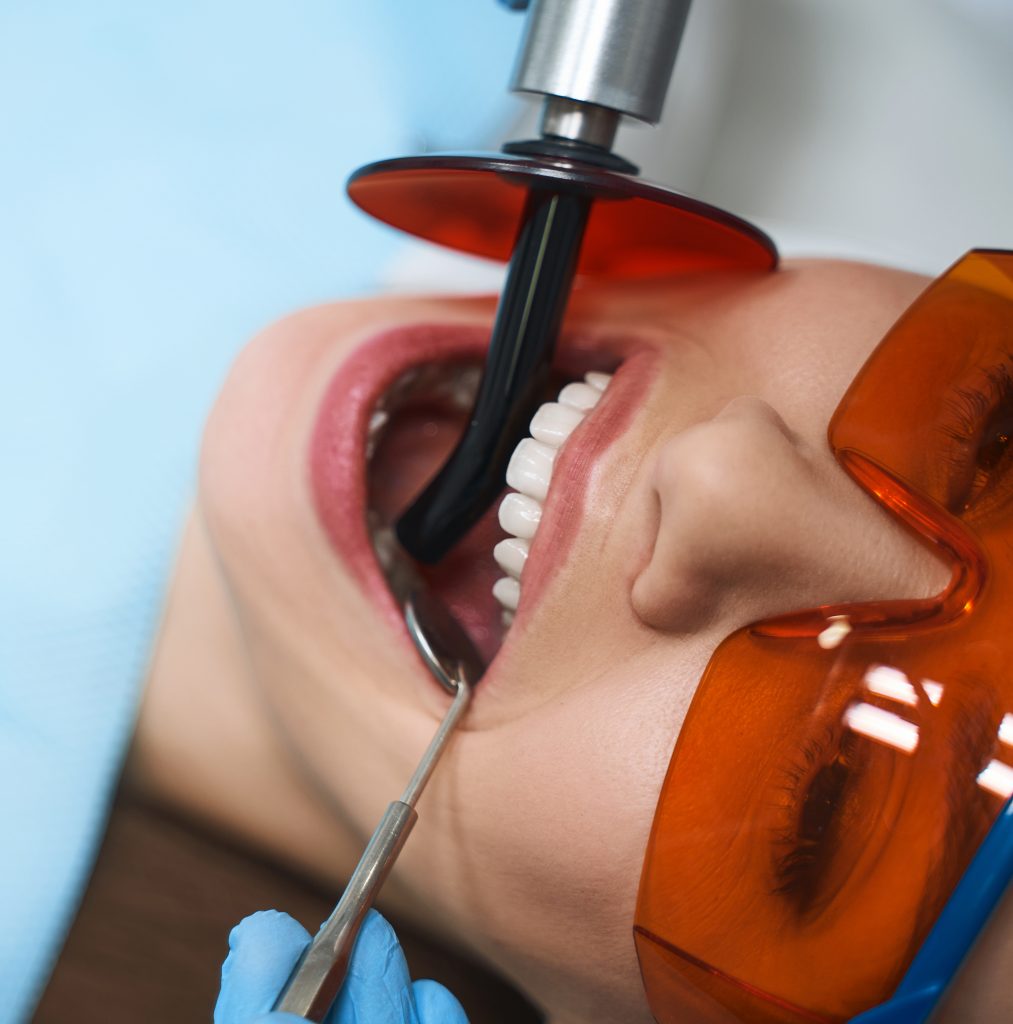 Woman is getting root canal Restorative Dentistry